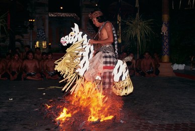 Portrait of a man riding a straw horse, walking on coals during fire dancing at night, Bali, Indonesia, Southeast Asia, Asia