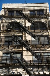 Fire escapes on the outside of buildings in Spring Street, Soho, Manhattan, New York City, New York, United States of America, North America