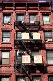 Classic old tenement building with fire escape, Chinatown, Manhattan, New York City, United States of America, North America