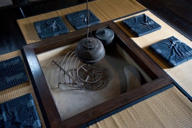 Sunken irori fire pit inside the Kyu Uchiyamake historic Samurai house in Echizen-Ono, Fukui, Japan, Asia