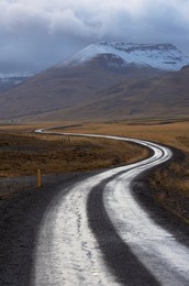 Road and landscape in Vatsnes Peninsula, with snow-covered mountains in October, north coast of Iceland, Iceland, Polar Regions