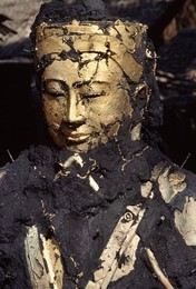 The face of Buddha emerging from the ashes, bronze casting, Mandalay, Myanmar (Burma), Asia