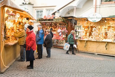 Shoppers at Christmas stalls of Stern Advent Markt market, Salzburg, Austria, Europe