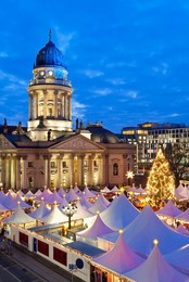 Traditional Christmas Market at Gendarmenmarkt, illuminated at dusk, Berlin, Germany, Europe