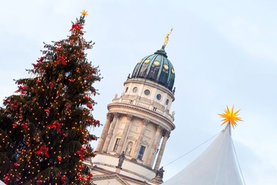 Traditional Christmas Market at Gendarmenmarkt, illuminated at dusk, Berlin, Germany, Europe