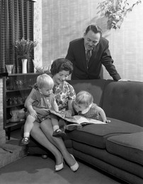 Family group looking at a brochure, Doncaster, South Yorkshire, 1963.