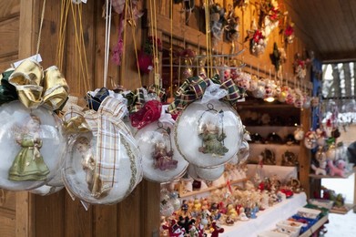 Christmas decorations of angels in glass balls at stall, Christmas Market at Schlosspark, Steyr, Oberosterreich (Upper Austria), Austria, Europe