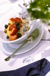 Healthy breakfast of muesli topped with fresh fruit