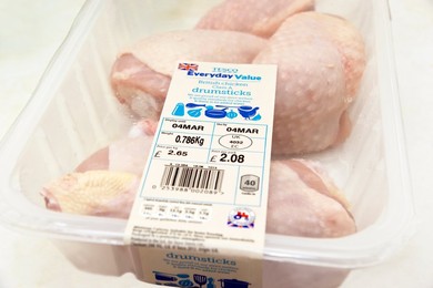 Pack of Tecso Everyday Value BRITISH chicken drumsticks with signs / logos of British farm standard logo from the assured food standards association of the little red tractor symbol & the Britsh union jack (strict welfare & quality standards)