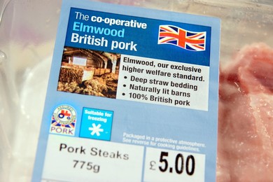 Pack of Co-operative Elmwood British Pork steaks / cutlets sourced from high standard farms with signs / logos of British farm standard logo from the assured food standards association of the little red tractor symbol & the Britsh union jack