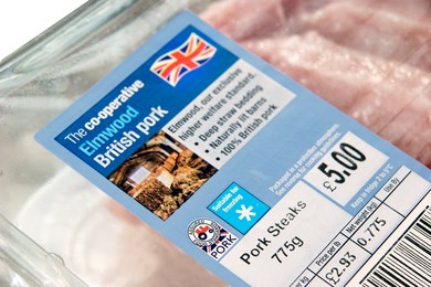 Pack of Co-operative Elmwood British Pork steaks / cutlets sourced from high standard farms with signs / logos of British farm standard logo from the assured food standards association of the little red tractor symbol & the Britsh union jack