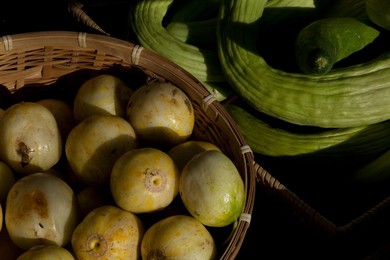 Farmer's Market: food, vendors and shoppers. Idaho. Organic cucumber.