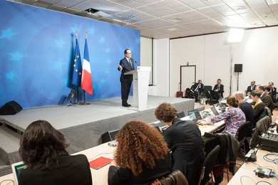 French President Francois Holland holds..........