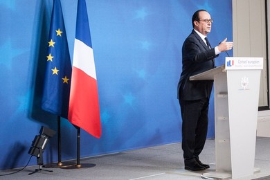 French President Francois Holland holds..........