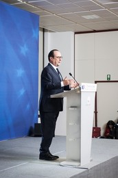 French President Francois Holland holds..........