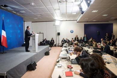 French President Francois Holland holds..........