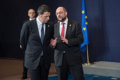 Italian Prime Minister Matteo Renzi (L)..........