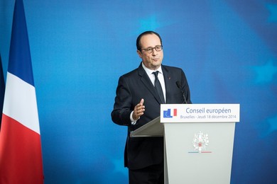 French President Francois Holland holds..........