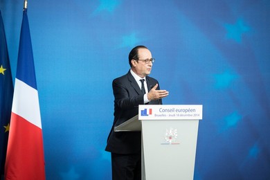 French President Francois Holland holds..........