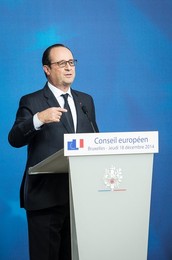 French President Francois Holland holds..........