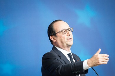 French President Francois Holland holds..........