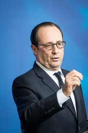 French President Francois Holland holds..........