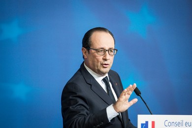 French President Francois Holland holds..........