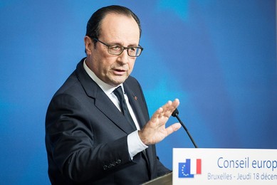 French President Francois Holland holds..........