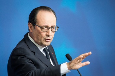 French President Francois Holland holds..........