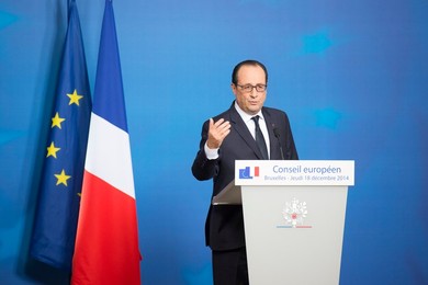 French President Francois Holland holds..........