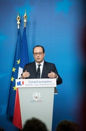 French President Francois Holland holds..........