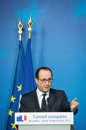 French President Francois Holland holds..........