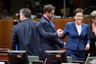 Polish Prime Minister Ewa Kopacz (L) is..........