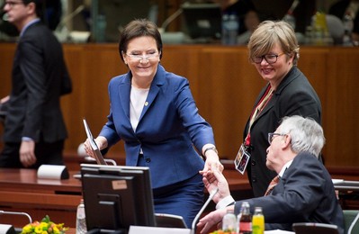 Polish Prime Minister Ewa Kopacz (L) is..........