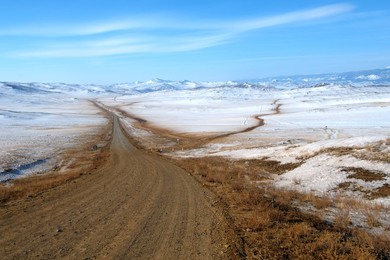 Road through winter landscape, Olkhon is..........