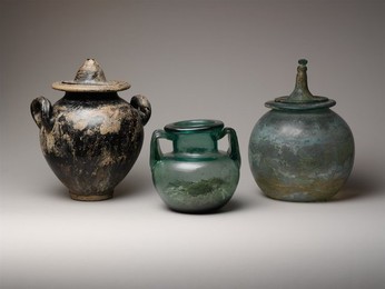 Glass two-handled jar with ashes