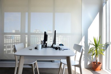 An empty working desk for two in home office