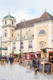 The Freyung Christmas market with Schottenkirche Catholic Church to the rear, Vienna city centre, Austria