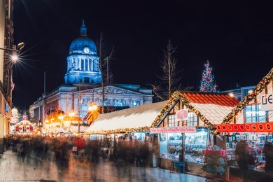 Christmas Market and City Council Building on Old Market Square at night, Nottingham, Nottinghamshire, England, United Kingdom