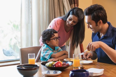 Happy family enjoying meal time