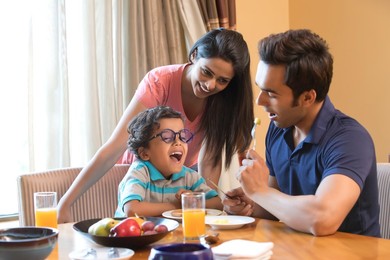 Happy family enjoying meal time