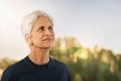 Senior woman looking away in nature