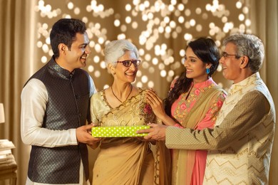 Happy Family Exchanging Gifts on the occasion of diwali festival