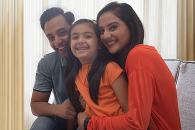 Happy family having fun together on sofa