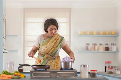 woman preparing food in kitchen