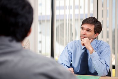 Business executive listening in a meeting