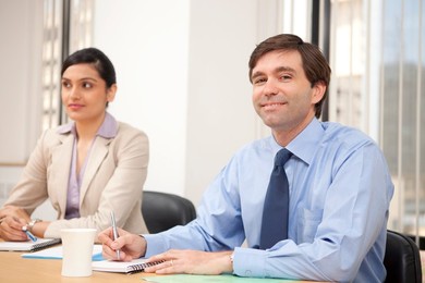 Portrait of an executive in a meeting