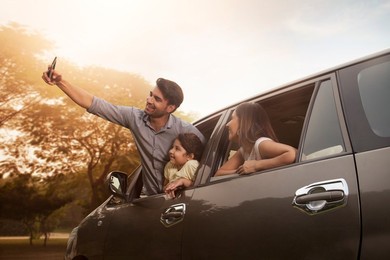 Family posing for the selfie in the nature during their excursion