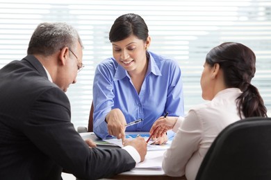 Male and female professionals discussing in meeting