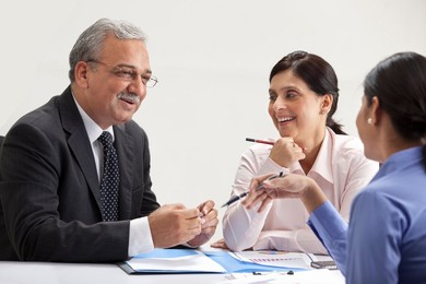 Happy executives discussing in a meeting